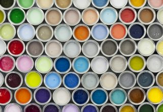 A variety of paint can samples arranged on a grid.